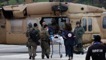 أثناء نقل إسرائيلي أصيب بشظايا صاروخ أطلق من لبنان، 14 فبراير 2024 (فرانس برس)