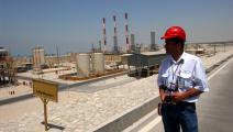 A safety supervisor monitors activities in Iran South Pars Gas Complex Company, a consortium of various Iranian, European and Asian companies creating one of the world largest natural gas refineries on Thursday, June 23, 2005, in Assaluyeh, Iran. Natural gas for this complex comes from a field in Persian Gulf, which Iran shares with Qatar. | Location: Assaluyeh, Bushehr, Iran. (Photo by Ramin Talaie/Corbis via Getty Images)