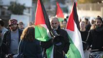 رفض الاحتلال ورفع العلم الفلسطيني في مظاهرة بحي الشيخ جراح (سعيد قاق/Getty)
