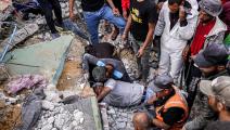 انتشال جثث ضحايا من مبنى منهار بغزة، مايو 2024 (فرانس برس)
