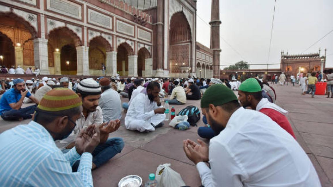 	NEW DELHI, INDIA - APRIL 14: People at the Jama Masjid during time for iftar, or the breaking of the fast, on the first day of Ramzan, on April 14, 2021 in New Delhi, India. Very much like last year, this time too, the festivities will be a bit different due to the COVID-19 pandemic. People are advised to stay inside and have to avoid stepping outside until utmost emergency during the holy month due to the virus. (Photo by Sanjeev Verma/Hindustan Times via Getty Images)