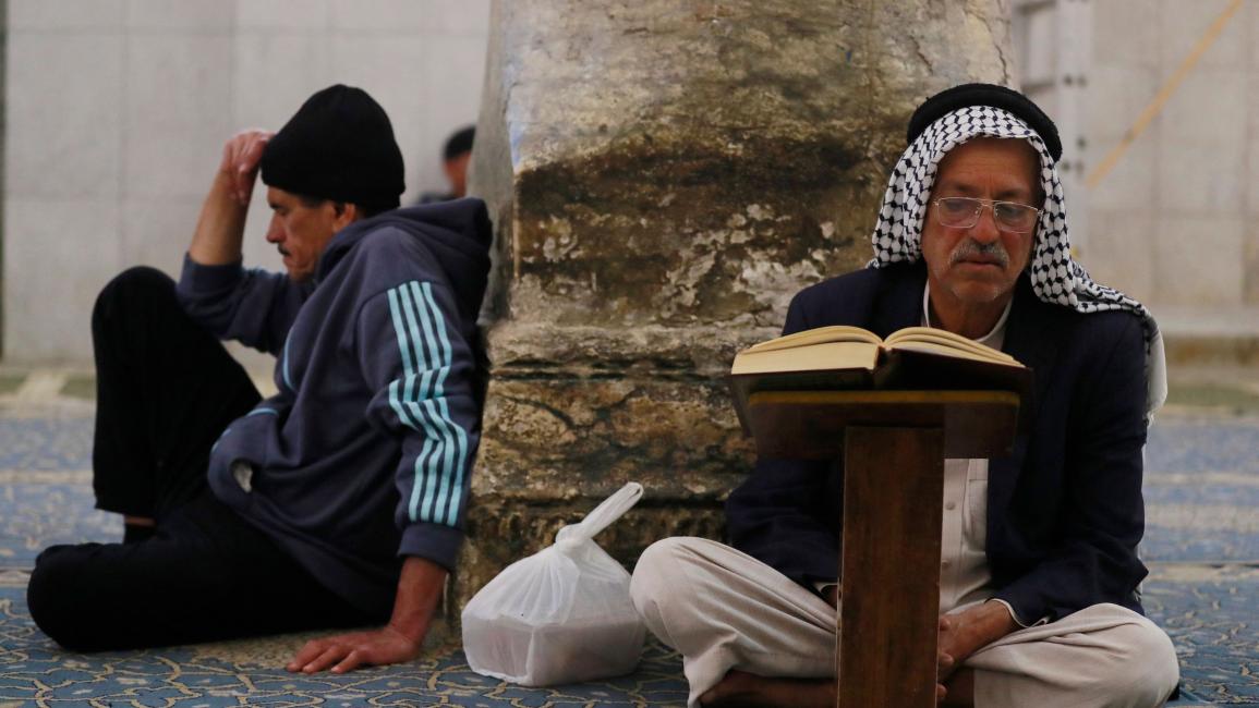 حرص على قراءة القرآن في العراق (أحمد الربيعي/ فرانس برس)