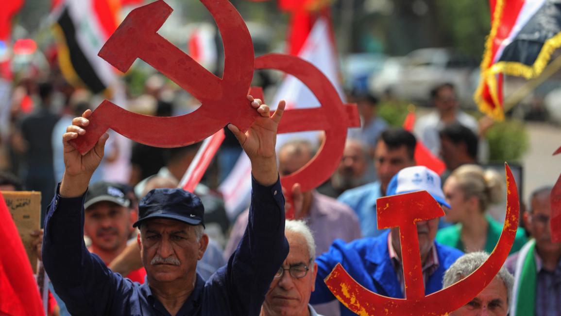 أنصار الحزب الشيوعي العراقي خلال مسيرة بمناسبة يوم العمال العالمي في ساحة الفردوس ببغداد (1/5/2024 فرانس برس)