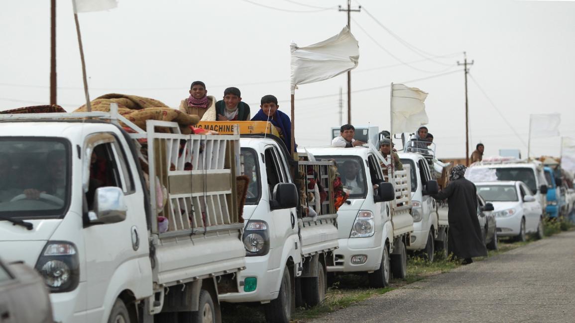 عراقيون يفرون من مناطق سيطرة داعش (فرانس برس)
