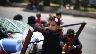 	 طفلة لعائلة سورية في طريقها عائدةً إلى سورية، يوليو 2023 (Getty)