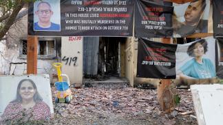 لافتات لأشخاص قتلوا أو خطفوا في مستوطنة بئيري 24 يونيو 2024 (Getty)