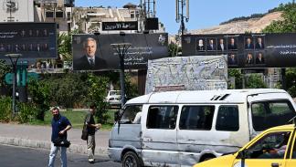 لافتات لمرشحي انتخابات مجلس الشعب السوري 14- 7- 2024 ( فرانس برس)