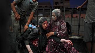 امرأة مصابة في خانيونس جنوبي قطاع غزة / 22 يوليو 2024 (Getty)