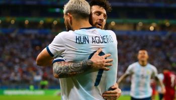 PORTO ALEGRE, BRAZIL - JUNE 23: Sergio Aguero of Argentina is congratulated by team-mate Lionel Messi after scoring his side's second goal during the Copa America Brazil 2019 group B match between Qatar and Argentina at Arena do Gremio on June 23, 2019 in Porto Alegre, Brazil. (Photo by Chris Brunskill/Fantasista/Getty Images)