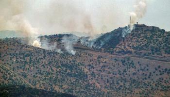 دخان يتصاعد في المنطقة الحدودية بالقرب من تلال كفر شوبا، 12 يونيو 2024 (Getty)