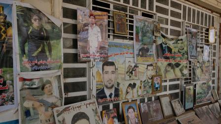 صور ضحايا جريمة سبايكر في مدينة تكريت العراقية، 20 مارس 2023 (Getty)