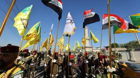 عناصر بكتائب حزب الله ببغداد، ديسمبر 2023 (أحمد الربيعي/فرانس برس)