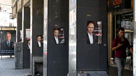 لافتات مرشحين لانتخابات النظام السوري، 10 يوليو 2024 (فرانس برس)